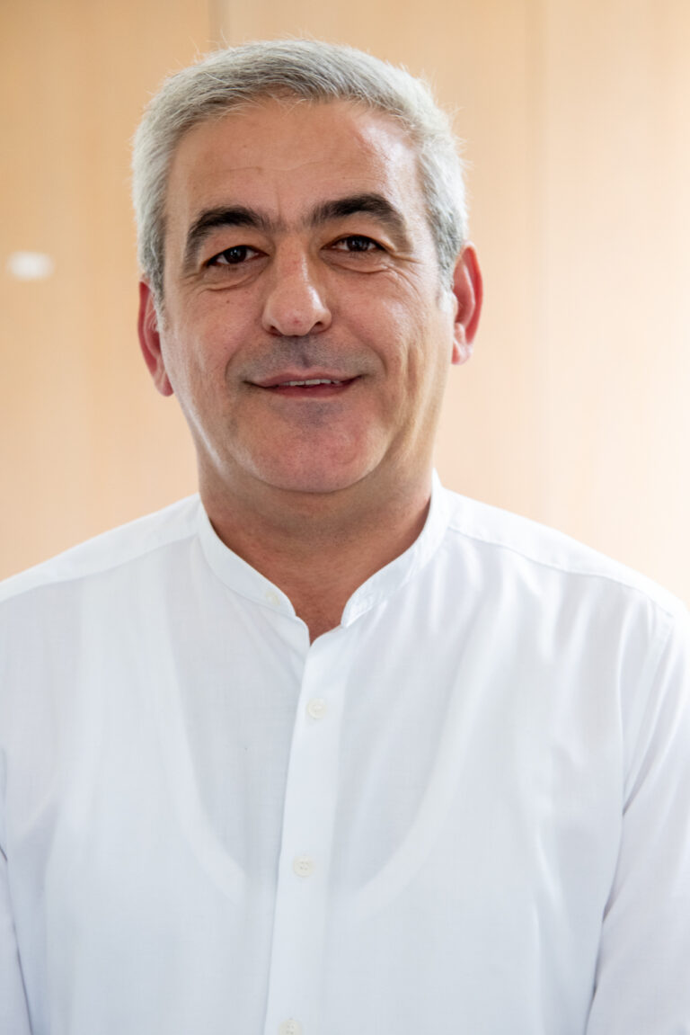 Portrait of smiling man in white shirt